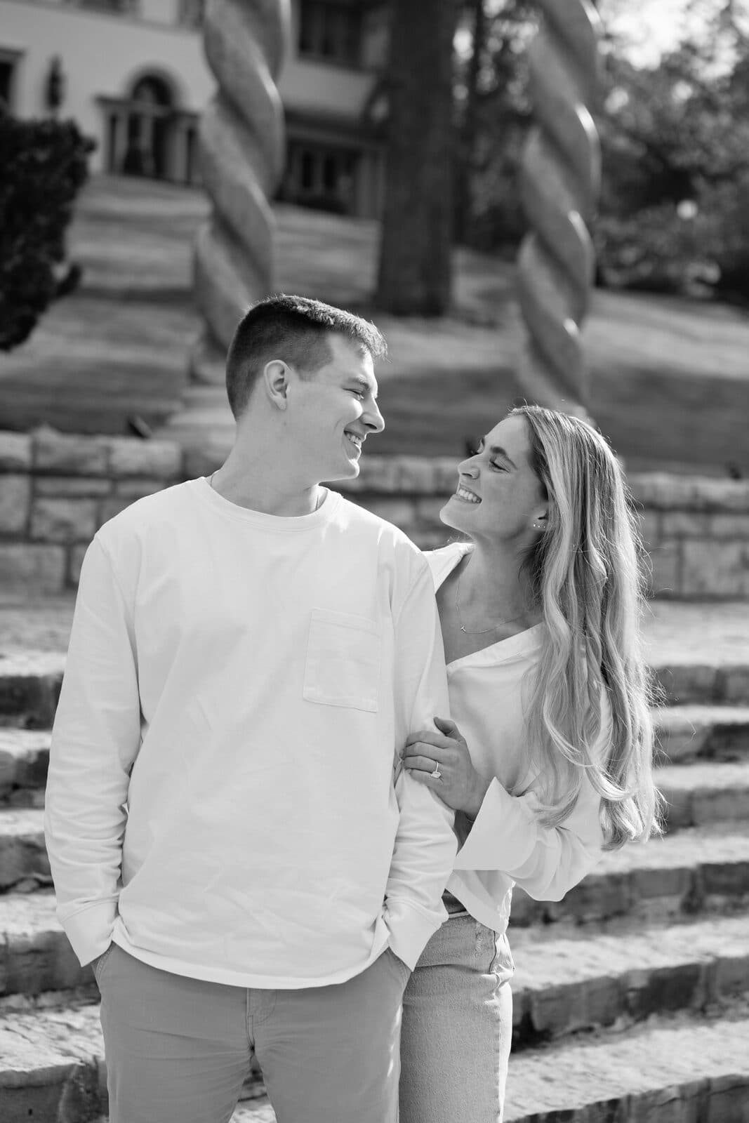 Sydney and Trenton gazing at one another on the stone steps.