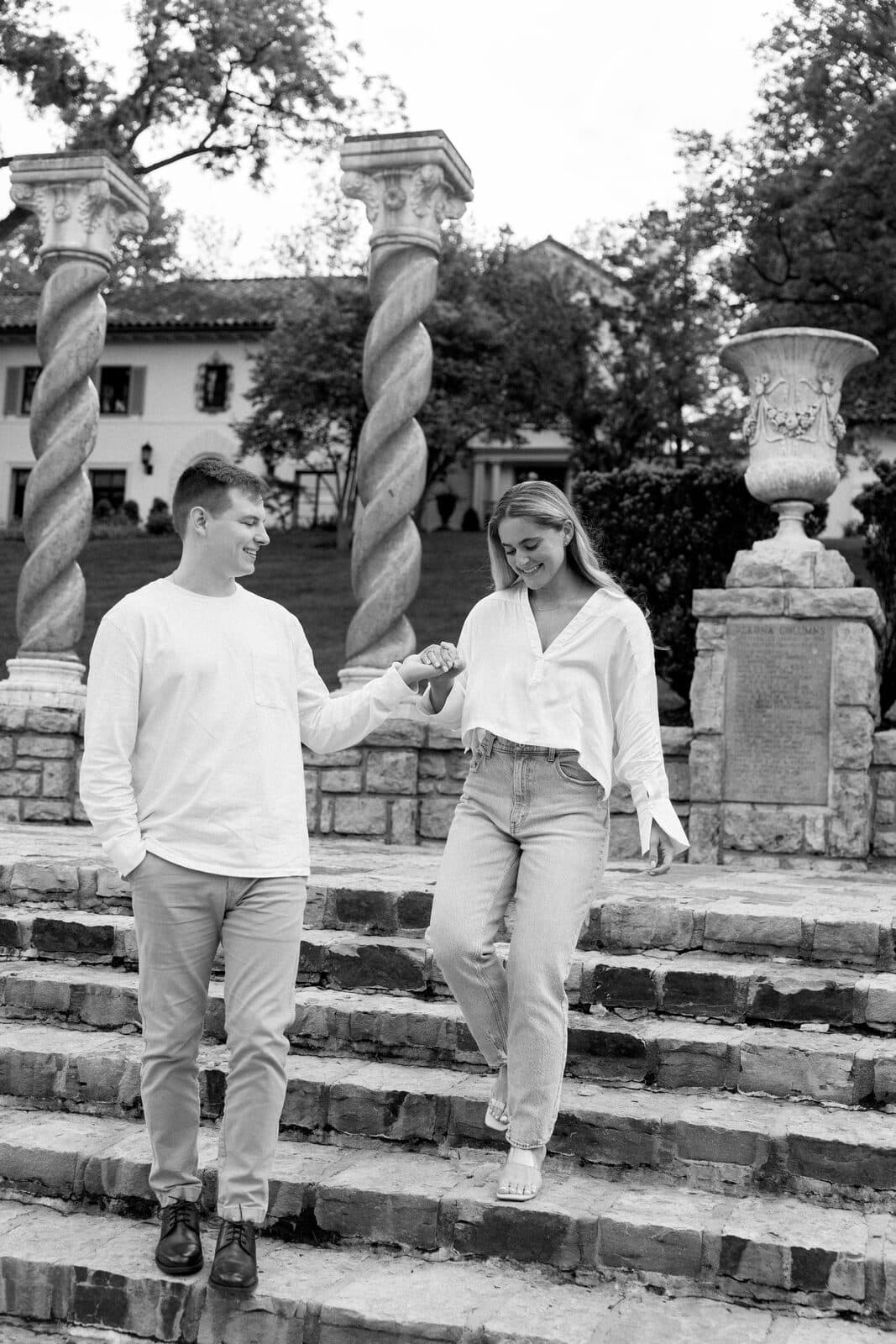 Sydney and Trenton sharing a kiss on the garden steps.