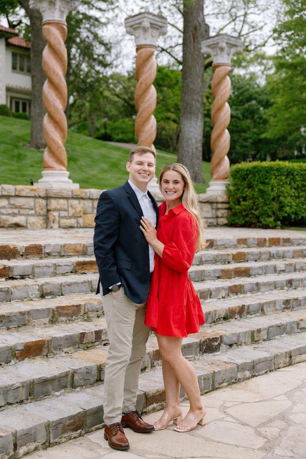 Sydney and Trenton on the steps, the columns rising behind them.