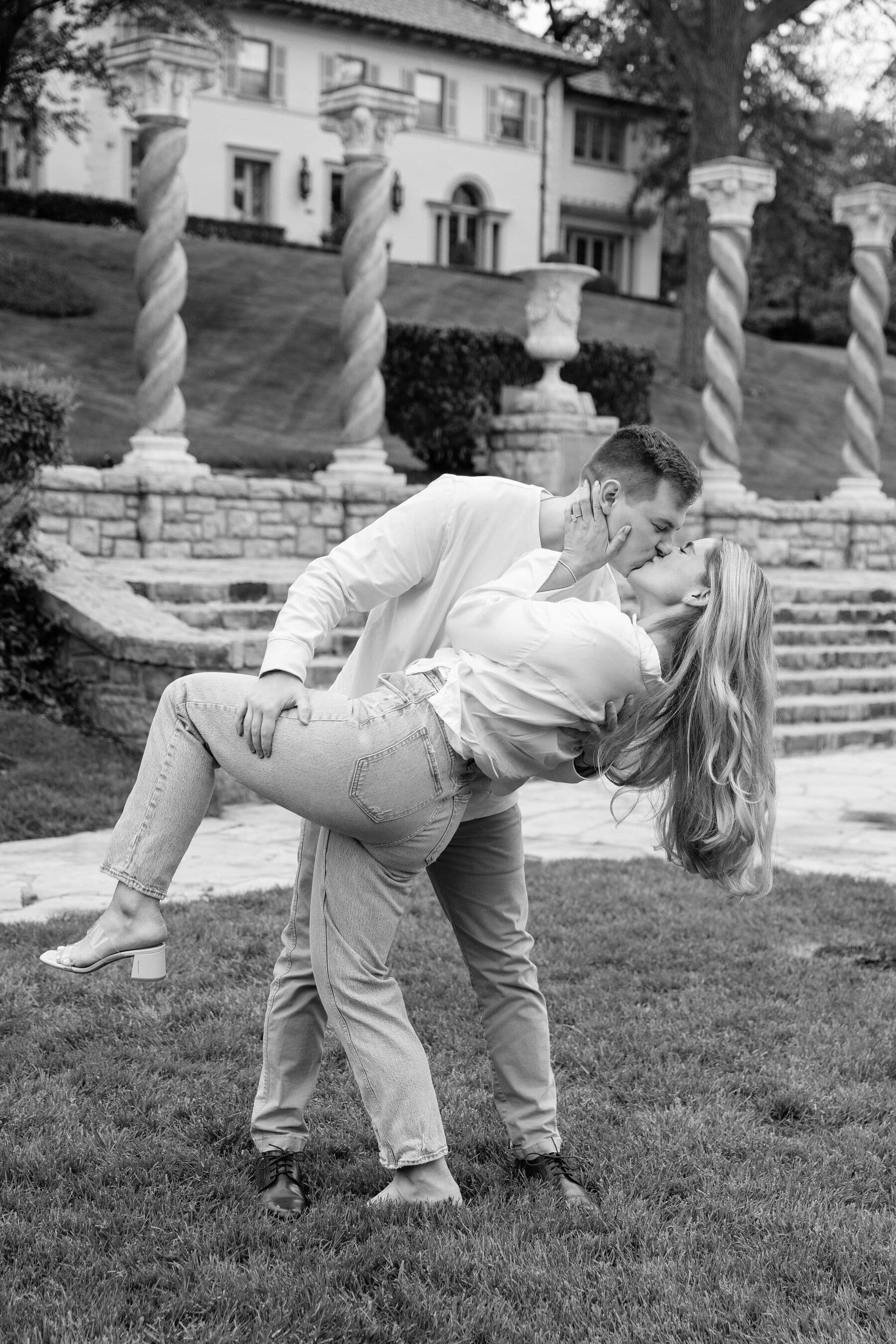 Sydney and Trenton sharing a kiss for their engagement portraits in Kansas City.